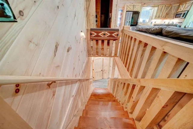a view of stairs with wooden floor