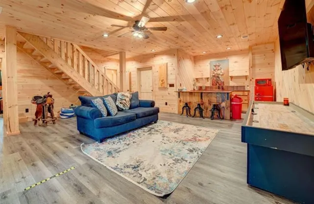 a living room with furniture and a flat screen tv
