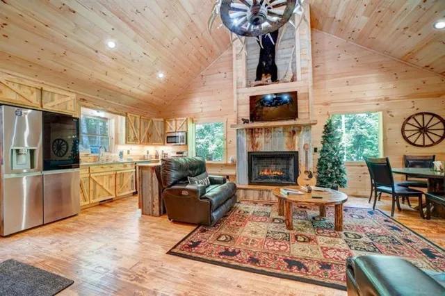 a living room with furniture a rug and a fireplace