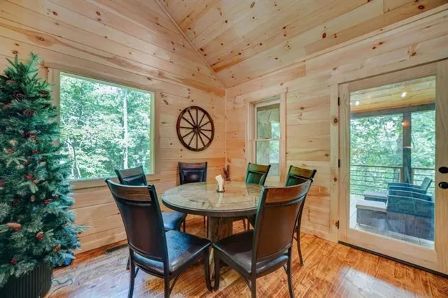 a view of a dining room with furniture window and outside view