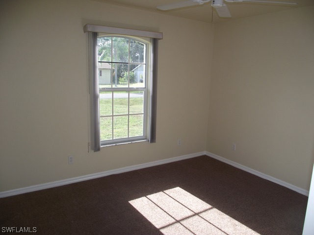 18485 Geranium Road Fort Myers, FL 33967 - Photo 3 of 9 an empty room with a window