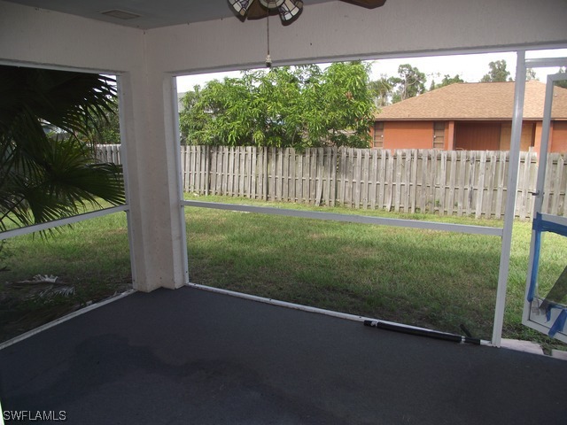 18485 Geranium Road Fort Myers, FL 33967 - Photo 4 of 9 a backyard of a house with lots of green space and outdoor seating