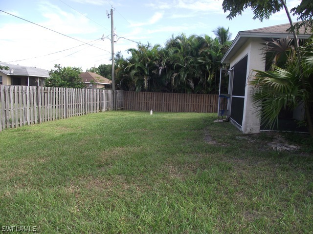 18485 Geranium Road Fort Myers, FL 33967 - Photo 8 of 9 a view of a backyard with green space