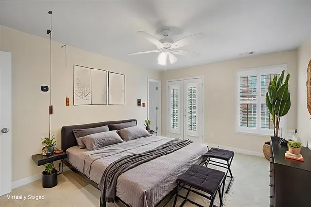 a bedroom with furniture and a window