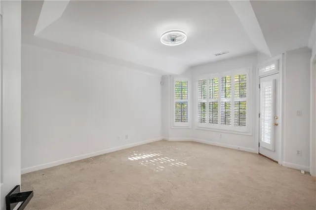 an empty room with a empty space and a window