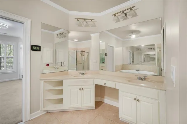 a spacious bathroom with a granite countertop sink mirror and double