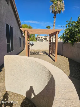 a roof deck with couch and chairs