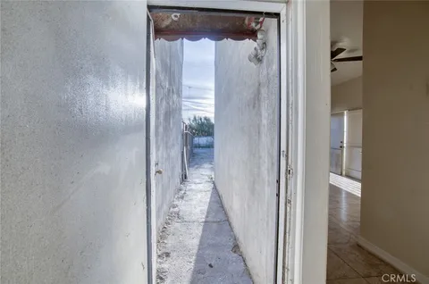 a view of a bathroom from a hallway