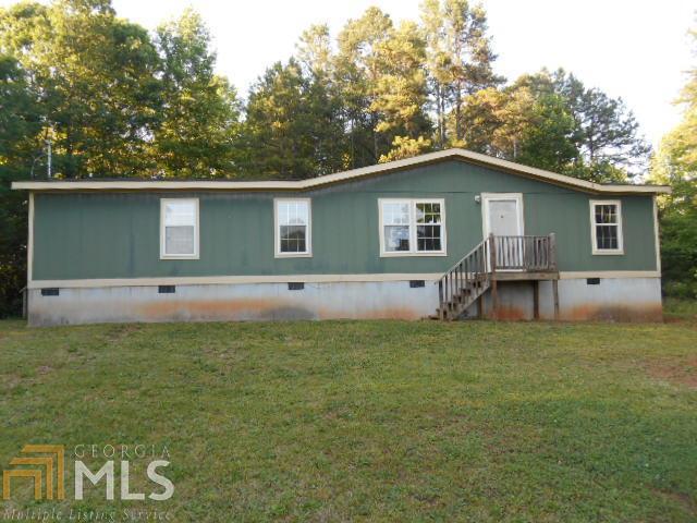 2181 Gumlog Road Martin, GA 30557 - Photo 1 of 1 a house with trees in the background