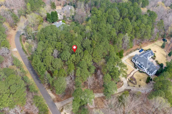 an aerial view of a house with lots of trees