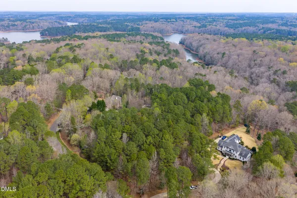 an aerial view of house with yard and mountain view