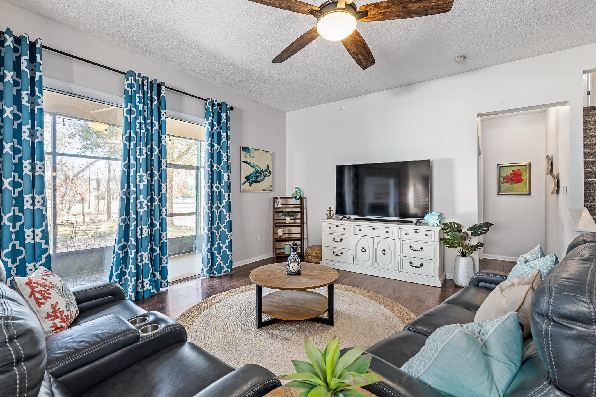 1353 Camp Ridge Lane Middleburg, FL 32068 - Photo 15 of 88 Living room with a textured ceiling, ceiling fan, and wood finished floors