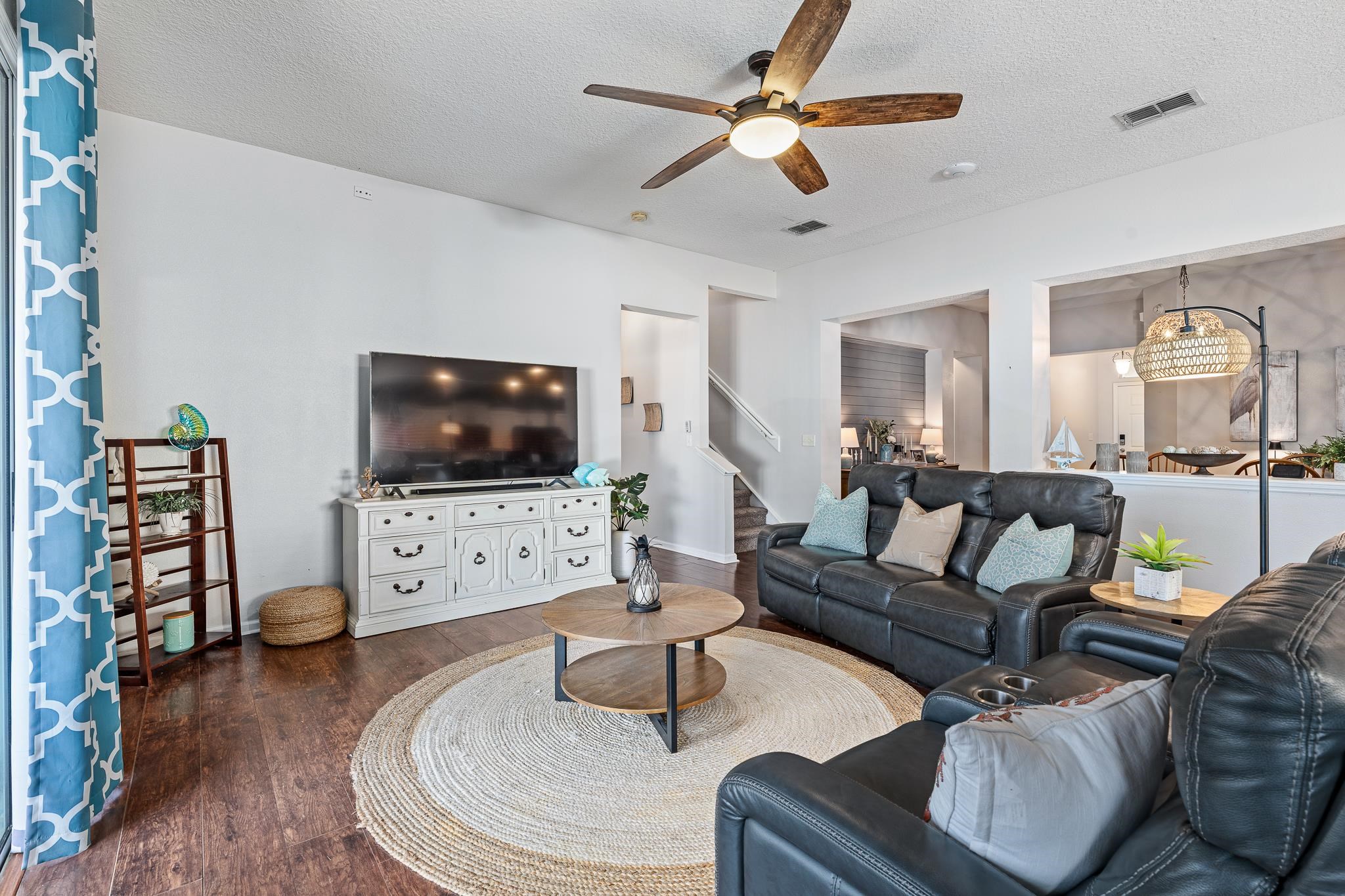 1353 Camp Ridge Lane Middleburg, FL 32068 - Photo 17 of 88 Living area featuring ceiling fan, a textured ceiling, wood finished floors, and suspended lighting