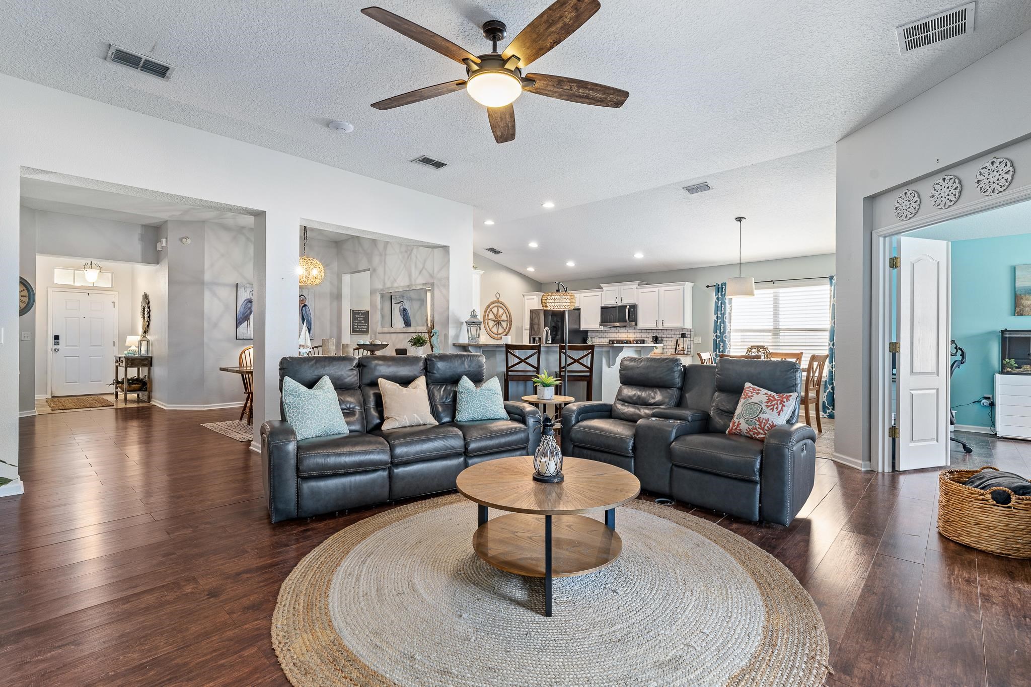 1353 Camp Ridge Lane Middleburg, FL 32068 - Photo 19 of 88 a living room with furniture kitchen view and a wooden floor