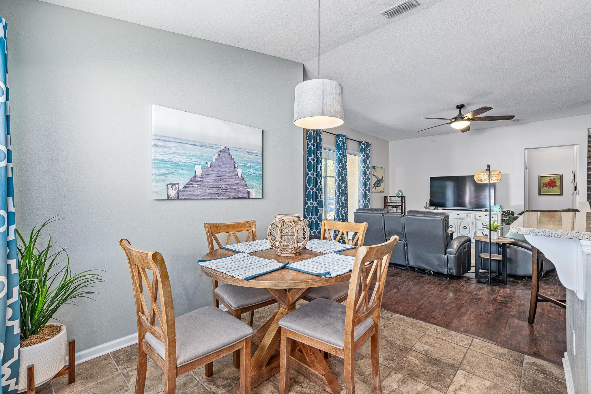 1353 Camp Ridge Lane Middleburg, FL 32068 - Photo 24 of 88 Dining space with ceiling fan, a textured ceiling, and stone finish floors