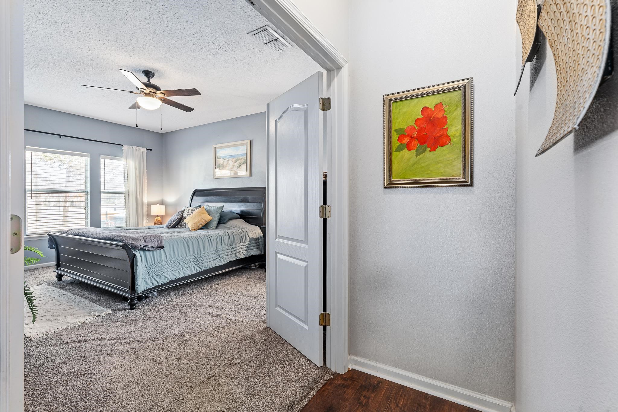 1353 Camp Ridge Lane Middleburg, FL 32068 - Photo 29 of 88 Bedroom with a ceiling fan, a textured ceiling, and dark wood-style flooring