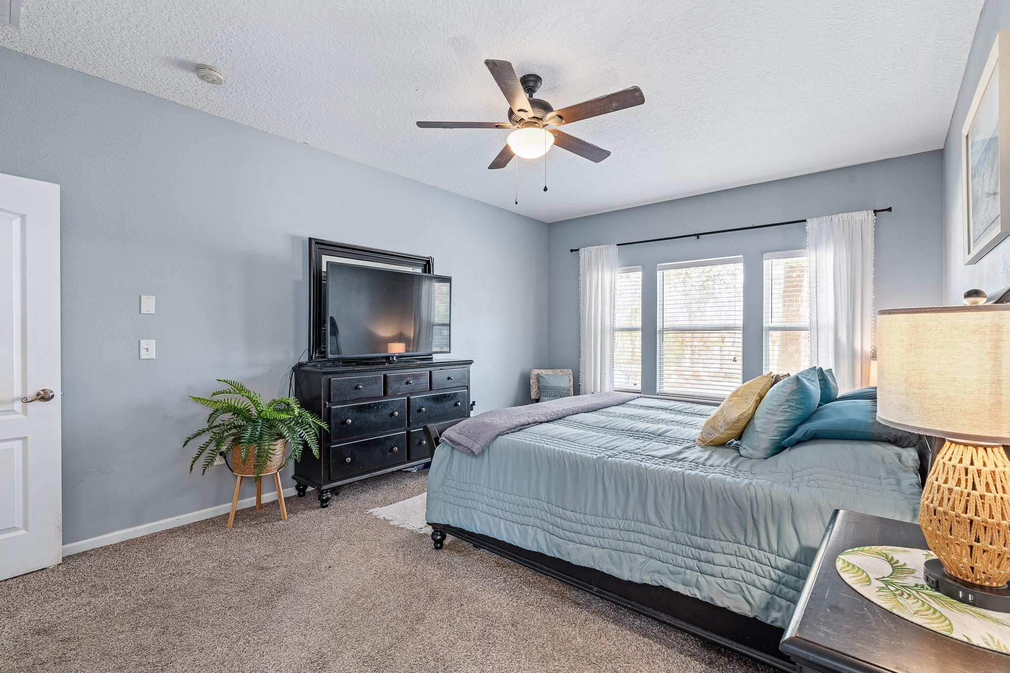 1353 Camp Ridge Lane Middleburg, FL 32068 - Photo 31 of 88 Carpeted bedroom featuring a ceiling fan and a textured ceiling