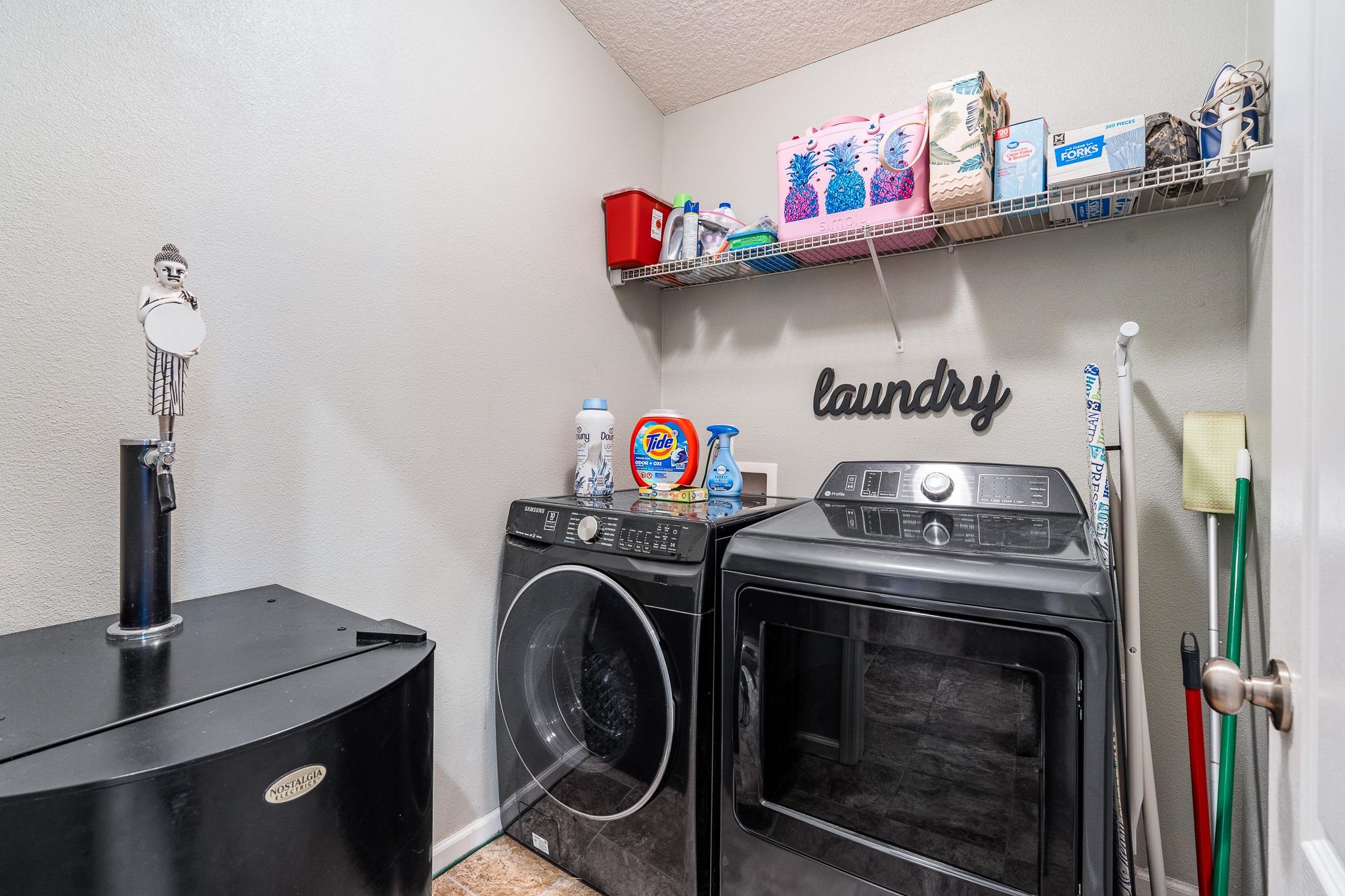 1353 Camp Ridge Lane Middleburg, FL 32068 - Photo 36 of 88 Laundry area with washing machine and clothes dryer and a textured ceiling