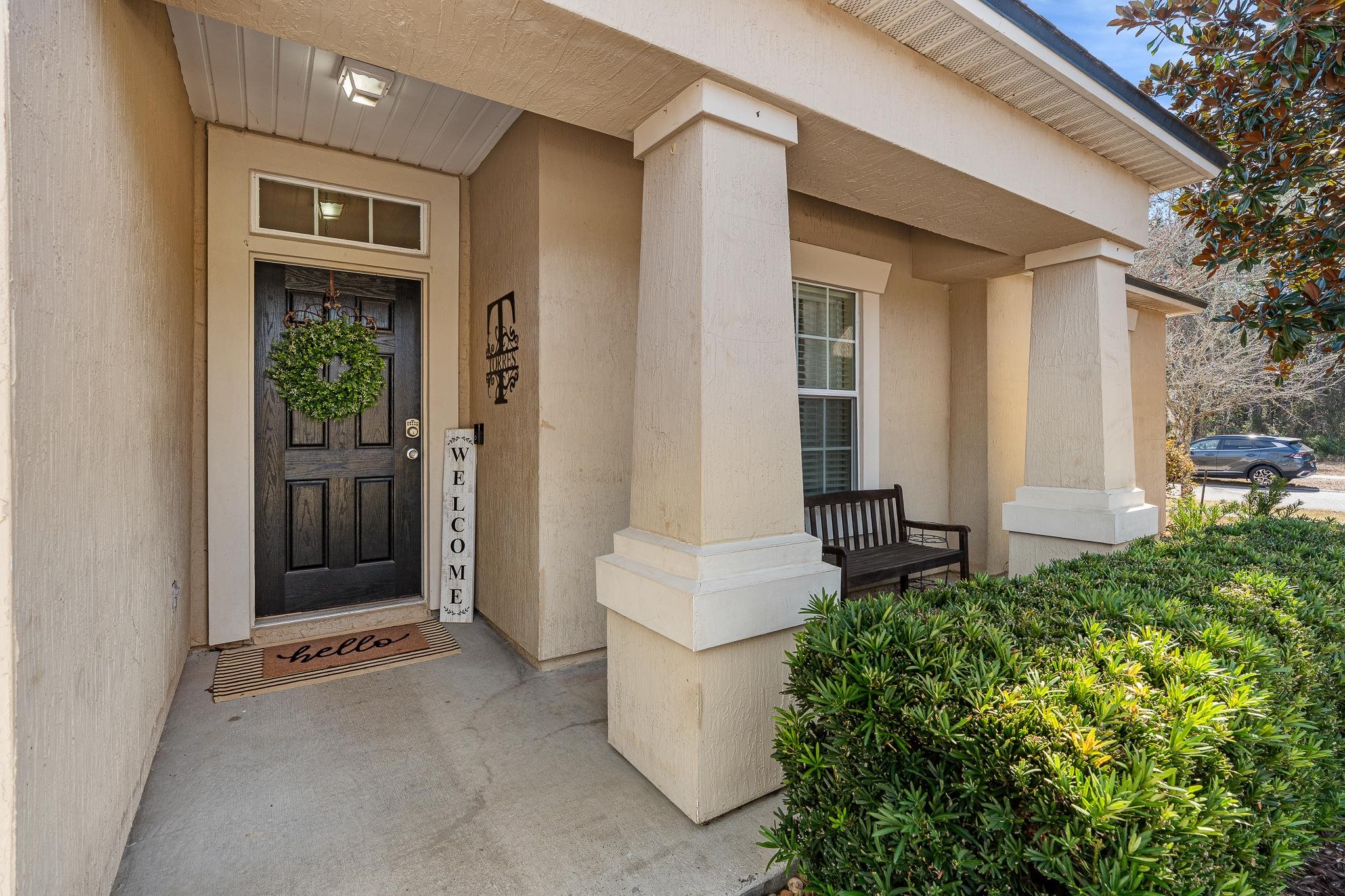1353 Camp Ridge Lane Middleburg, FL 32068 - Photo 4 of 88 Property entrance with covered porch and stucco siding
