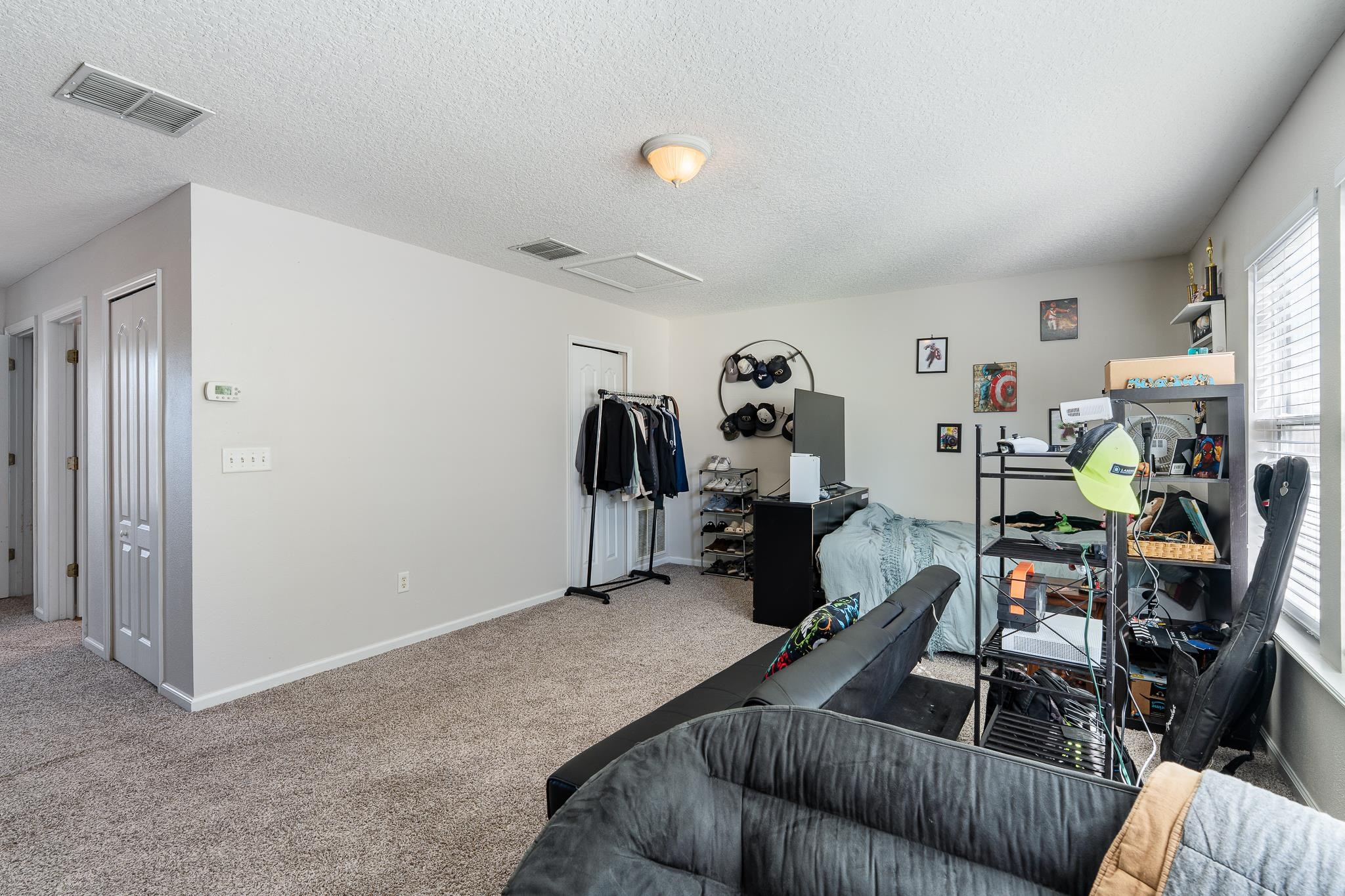 1353 Camp Ridge Lane Middleburg, FL 32068 - Photo 49 of 88 Workout room featuring carpet flooring and a textured ceiling