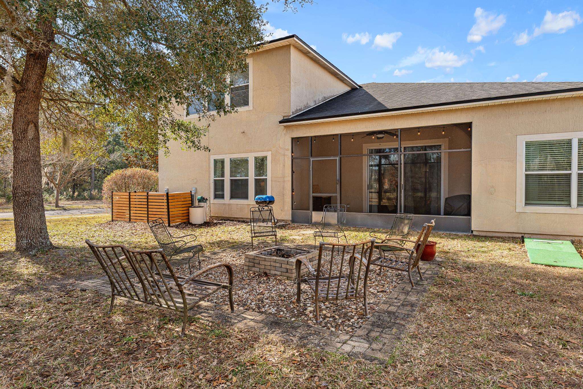 1353 Camp Ridge Lane Middleburg, FL 32068 - Photo 52 of 88 a view of a house with backyard sitting area and garden