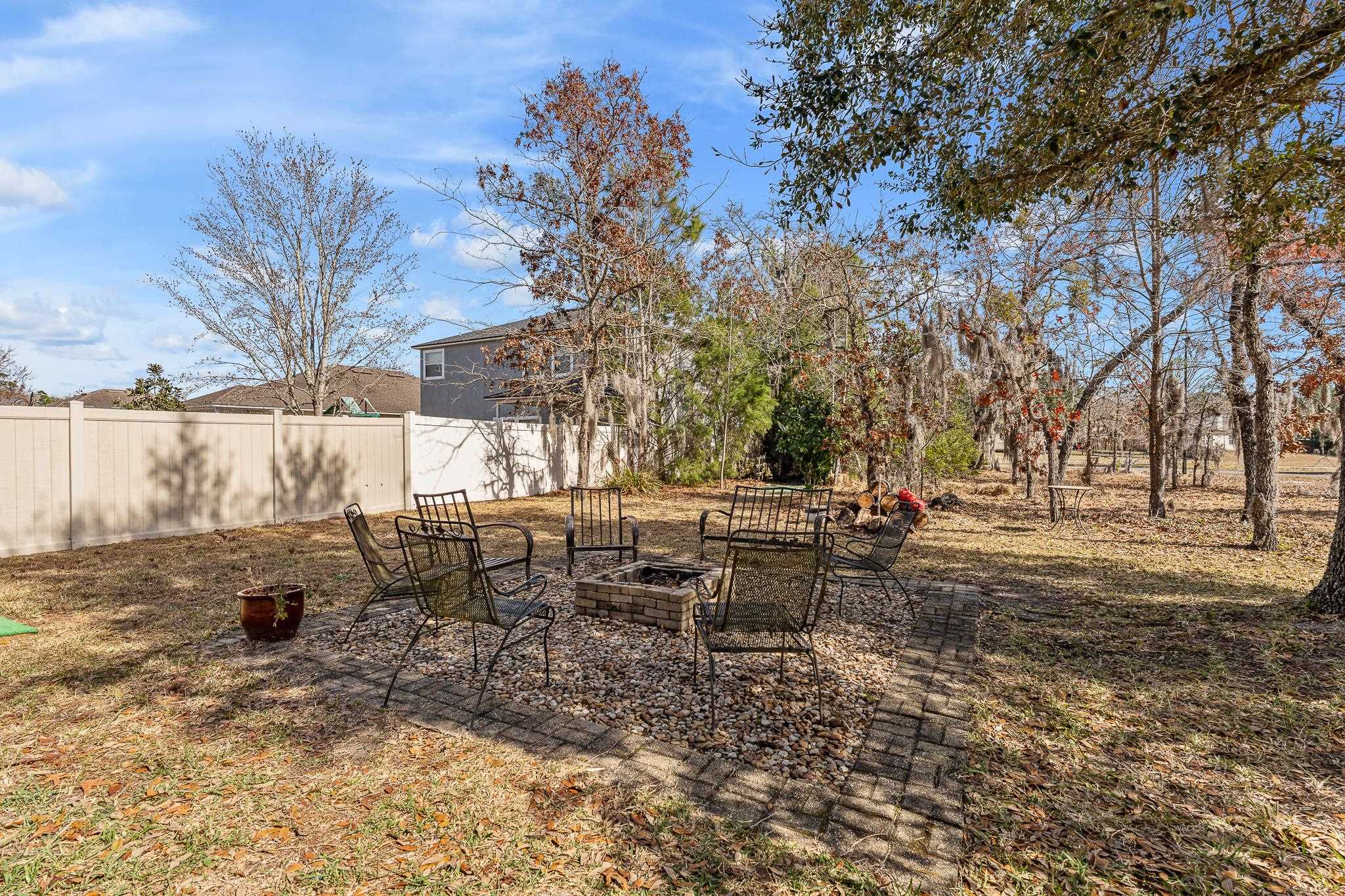 1353 Camp Ridge Lane Middleburg, FL 32068 - Photo 53 of 88 View of yard featuring an outdoor fire pit and a patio