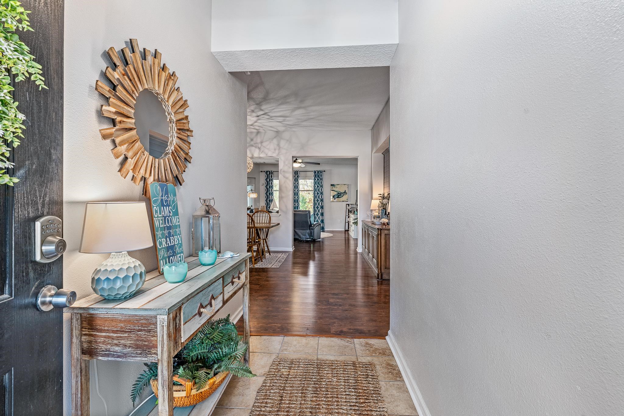 1353 Camp Ridge Lane Middleburg, FL 32068 - Photo 8 of 88 Corridor featuring light tile patterned floors and a textured wall