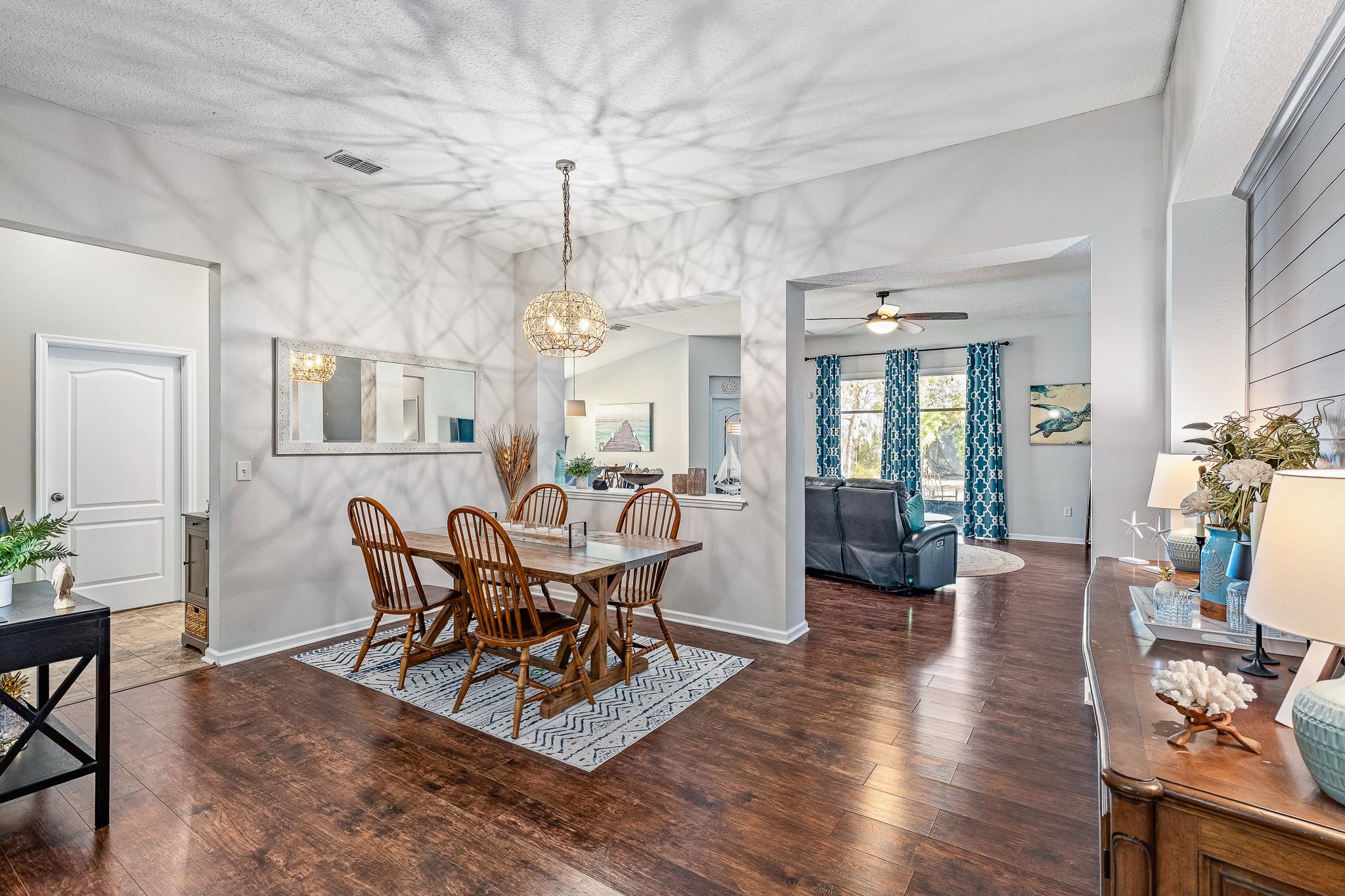 1353 Camp Ridge Lane Middleburg, FL 32068 - Photo 9 of 88 Dining area with dark wood finished floors, a ceiling fan, and suspended lighting