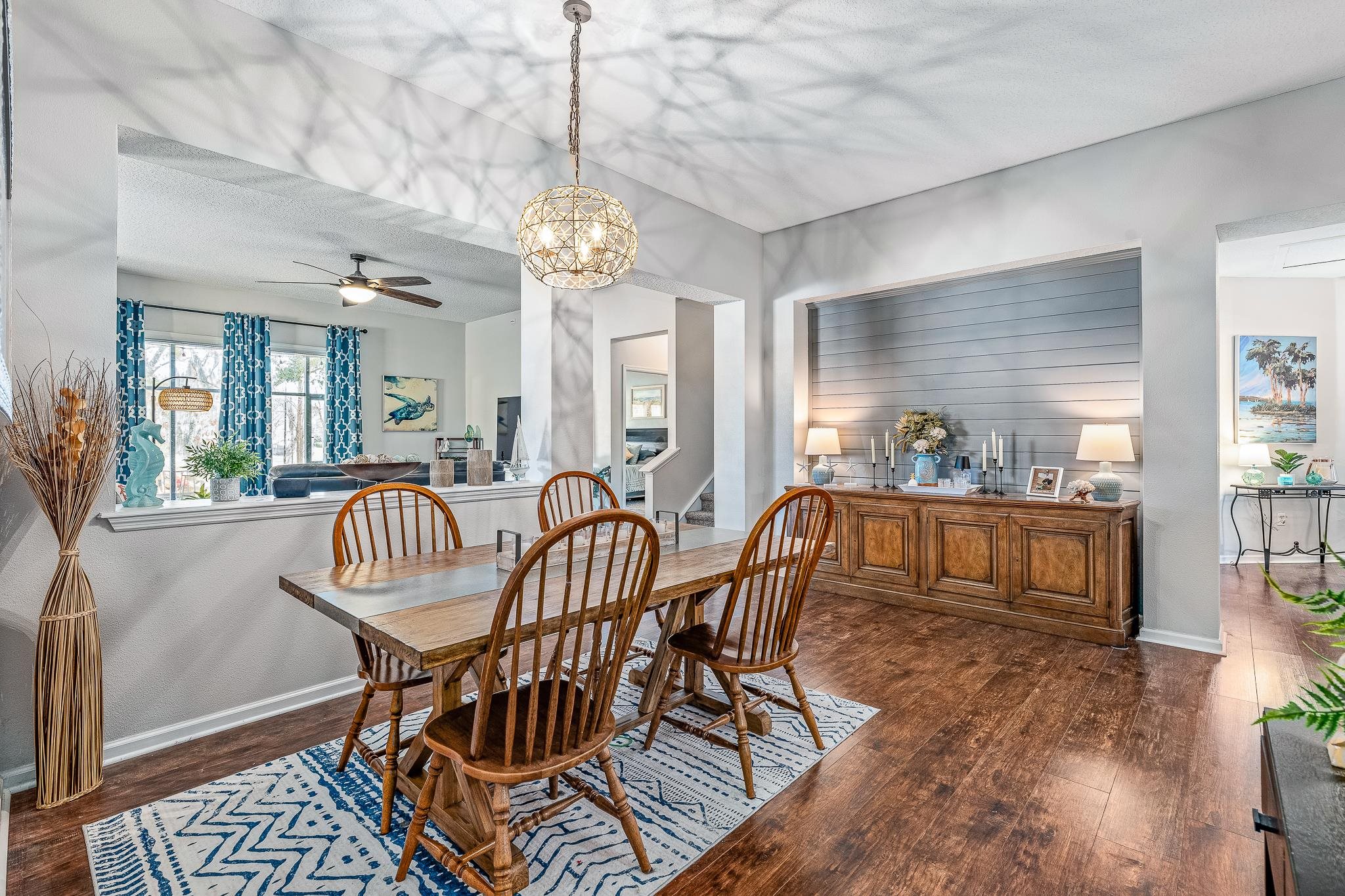 1353 Camp Ridge Lane Middleburg, FL 32068 - Photo 10 of 88 Dining space featuring dark wood-type flooring, ceiling fan, and a chandelier