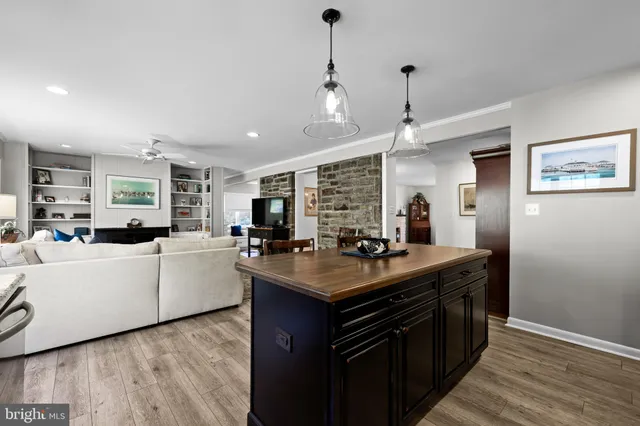 a kitchen with sink stove and cabinets