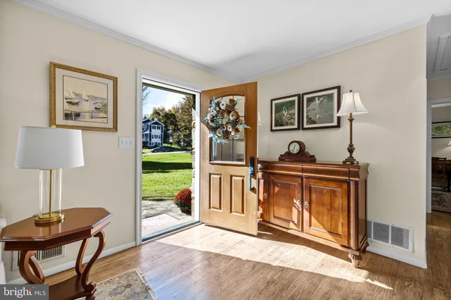 a view of a livingroom with furniture and a window