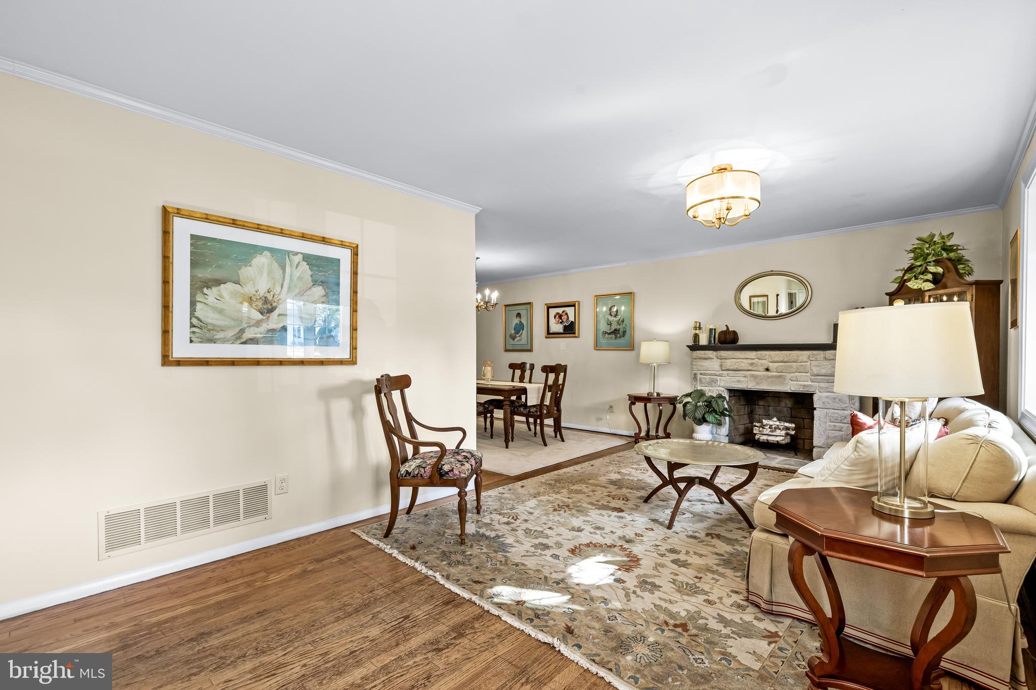 1806 Roland Avenue Ruxton, MD 21204 - Photo 5 of 43 a living room with furniture and a fireplace
