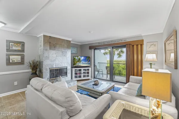a view of kitchen with stainless steel appliances granite countertop cabinets and a window