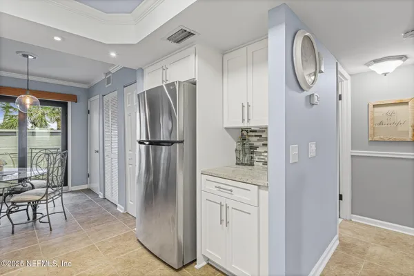 a front view of a house with a yard and fountain