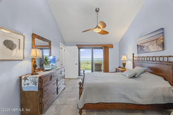 a bathroom with a granite countertop toilet sink and mirror