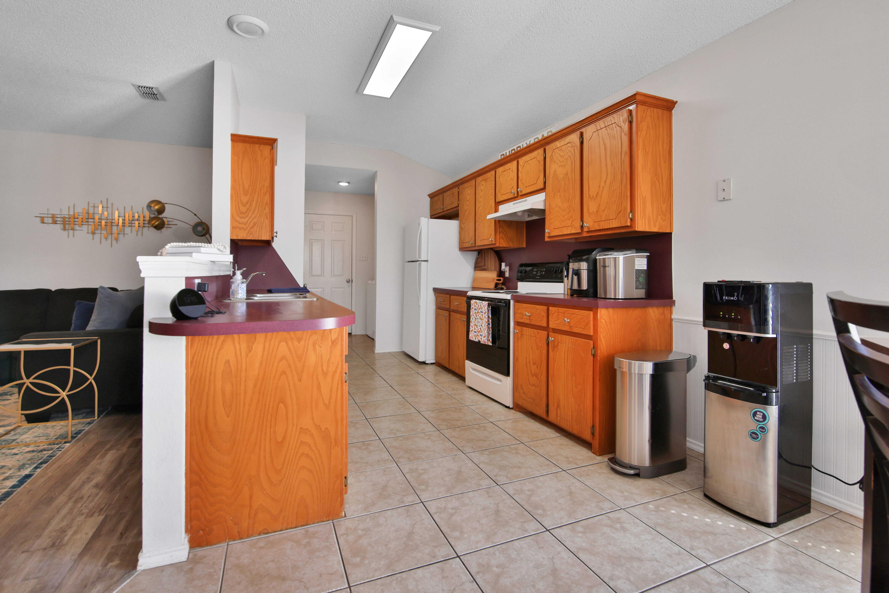 2907 90th Street Lubbock, TX 79423 - Photo 23 of 30 a kitchen with stainless steel appliances granite countertop a stove and a refrigerator