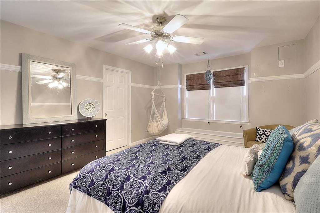 2018 Paper Birch Cove Grayson, GA 30017 - Photo 18 of 48 a bedroom with a bed and a closet with mirror