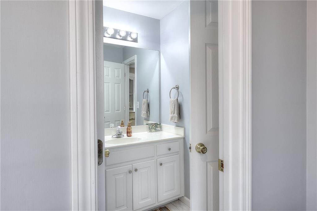 2018 Paper Birch Cove Grayson, GA 30017 - Photo 21 of 48 a bathroom with a double vanity sink and mirror