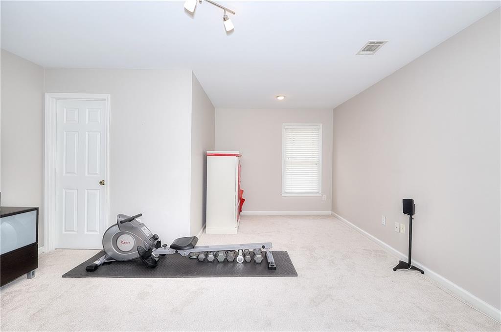 2018 Paper Birch Cove Grayson, GA 30017 - Photo 28 of 48 a view of a livingroom with furniture and a window