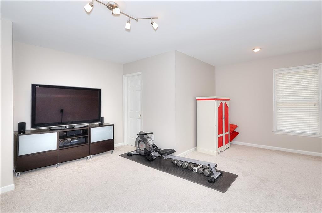 2018 Paper Birch Cove Grayson, GA 30017 - Photo 29 of 48 a living room with furniture and a flat screen tv