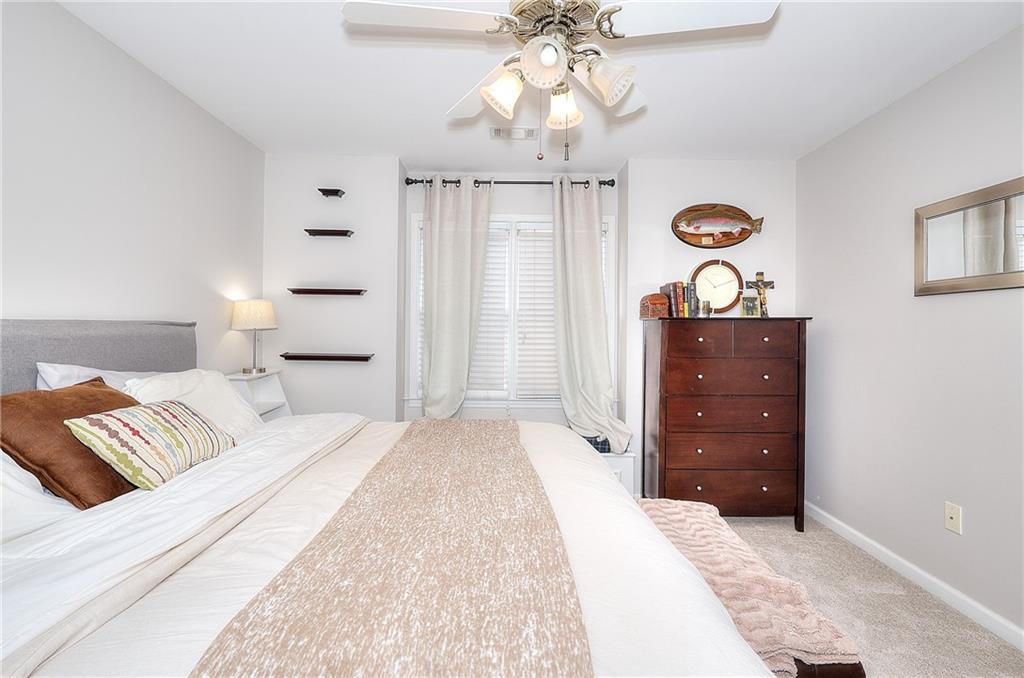 2018 Paper Birch Cove Grayson, GA 30017 - Photo 32 of 48 a bedroom with a bed and wooden floor