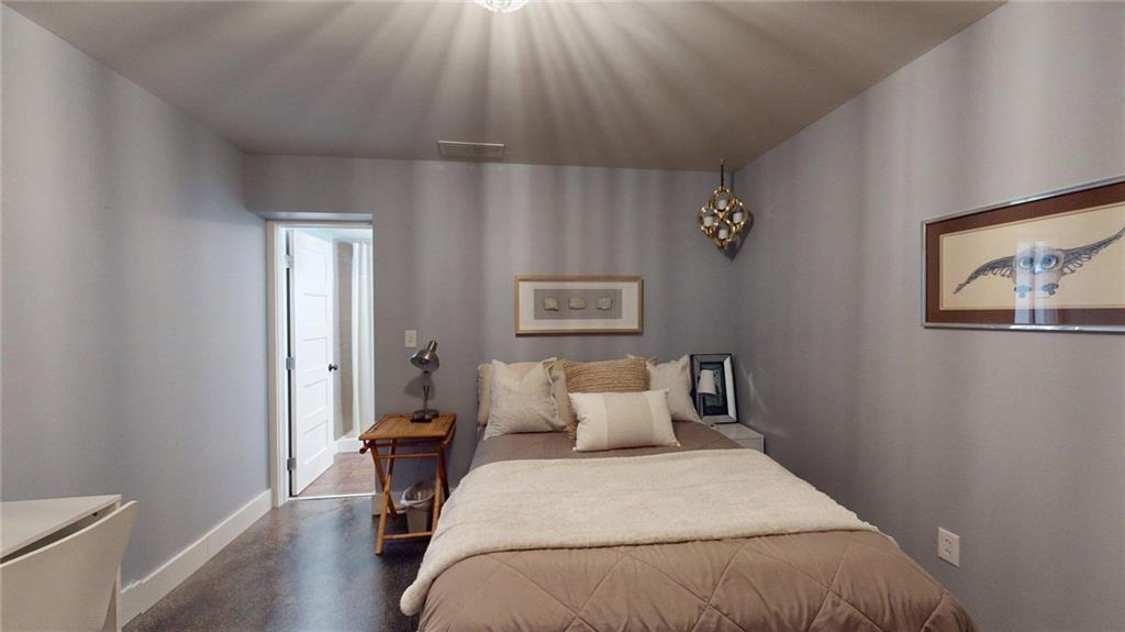 2018 Paper Birch Cove Grayson, GA 30017 - Photo 40 of 48 a bedroom with a bed and wooden floor