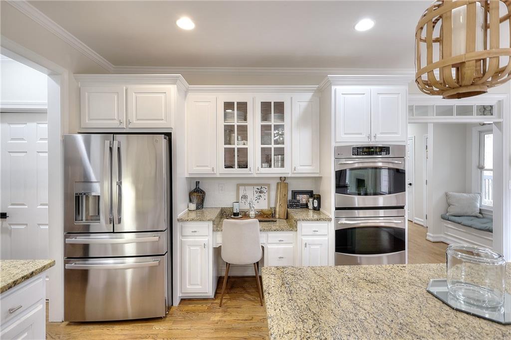 2018 Paper Birch Cove Grayson, GA 30017 - Photo 8 of 48 a kitchen with stainless steel appliances a stove a refrigerator and a fireplace