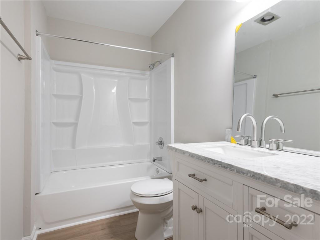 826 McAlway Road Charlotte, NC 28211 - Photo 10 of 30 a bathroom with a granite countertop sink toilet and shower
