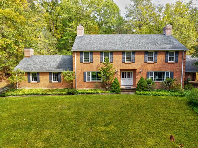 front view of a house with a yard