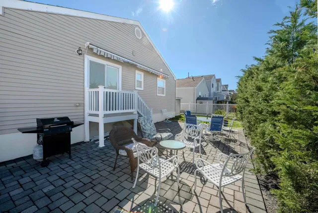 a view of a chairs and table in the patio