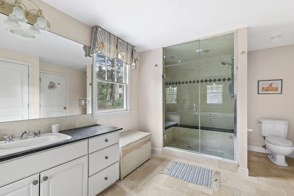 59 Crestview Road Milton, MA 02186 - Photo 13 of 32 a bathroom with a double vanity sink toilet and shower