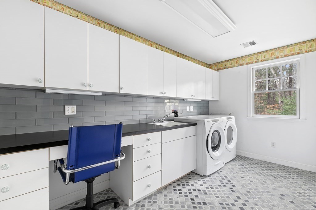 59 Crestview Road Milton, MA 02186 - Photo 18 of 32 a utility room with faucet a washer and dryer