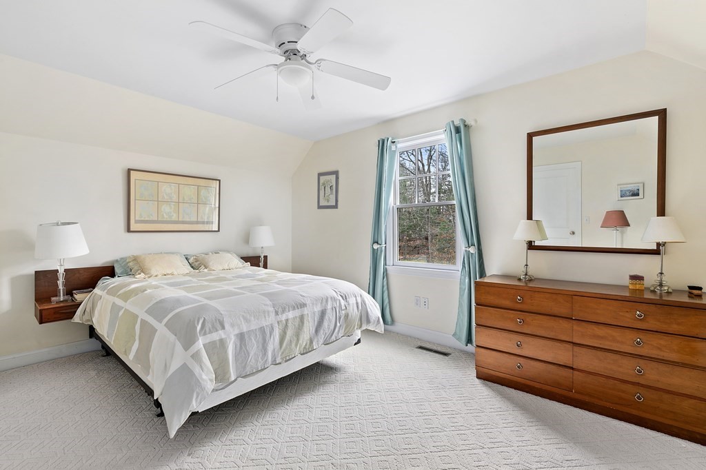 59 Crestview Road Milton, MA 02186 - Photo 20 of 32 a bedroom with a bed and a painting on the wall