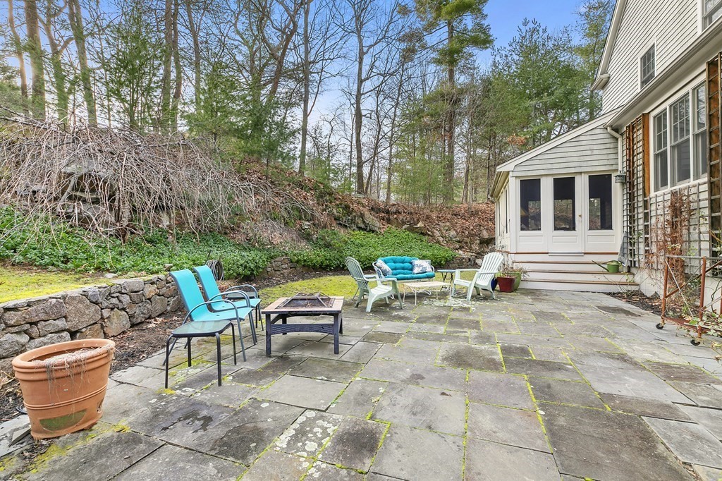 59 Crestview Road Milton, MA 02186 - Photo 25 of 32 a view of backyard with outdoor seating and plants